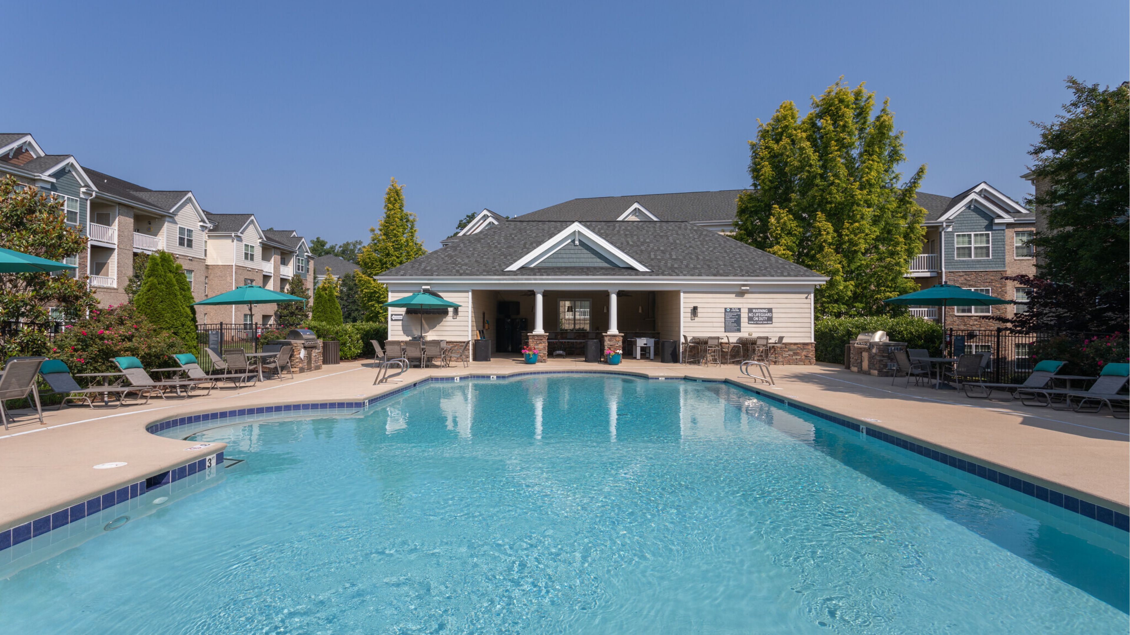 Hawthorne at Horse Pen Creek uxury outdoor pool with lounge chairs and surrounding seating